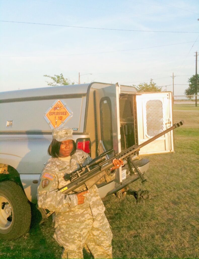 Black Female Soldier holding an M-60 machine gun