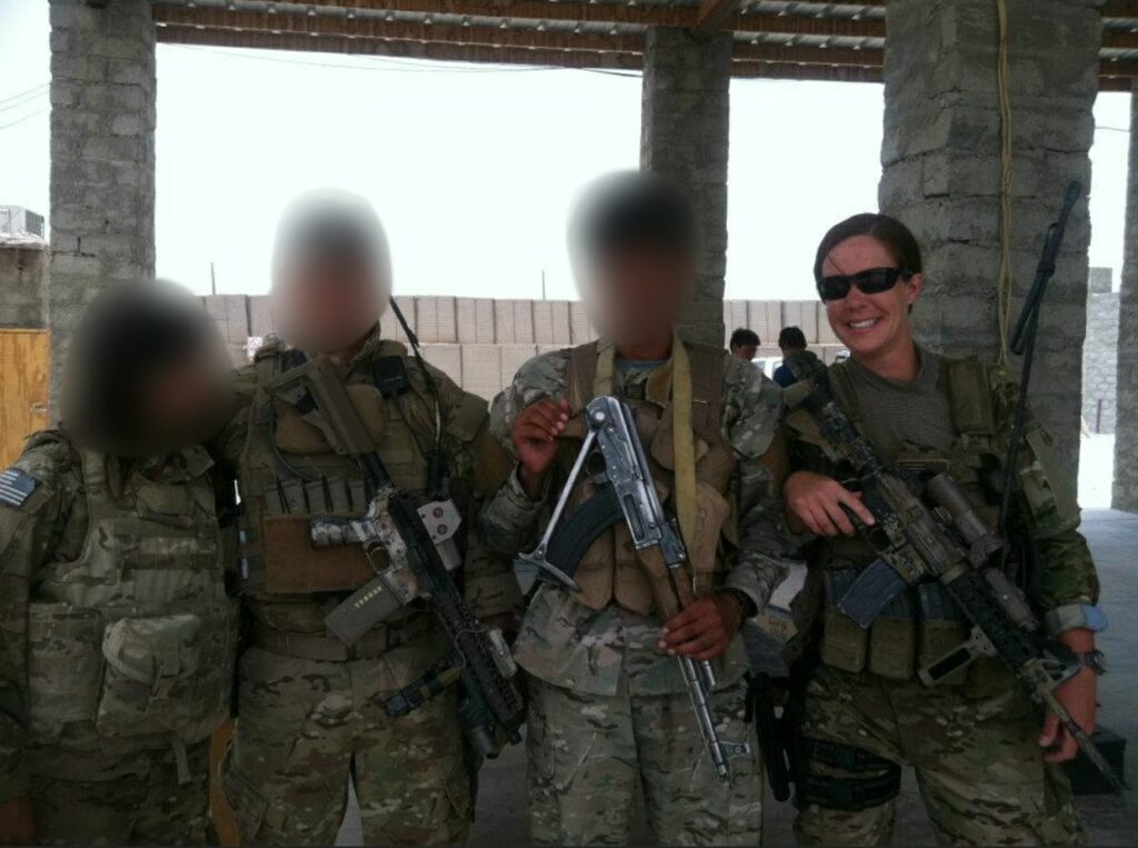 Women in Combat: MA1 Conley working with a small group