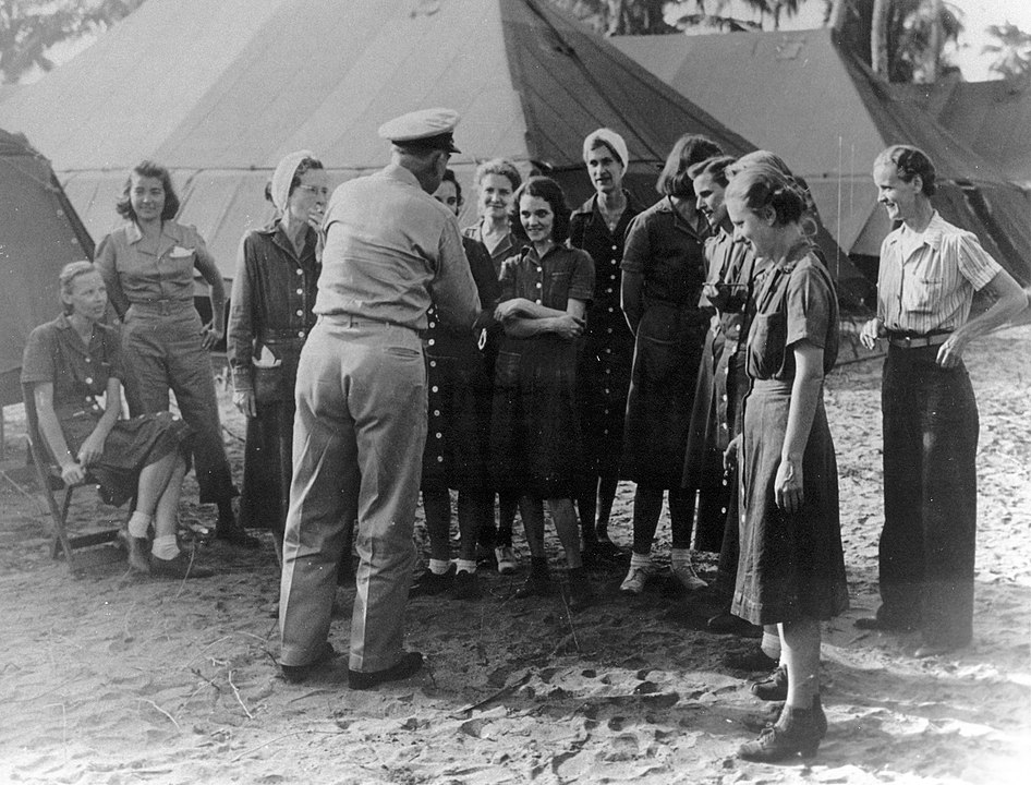A General speaking to rescued Navy Nurses at Los Banos, Philippines - 1945.