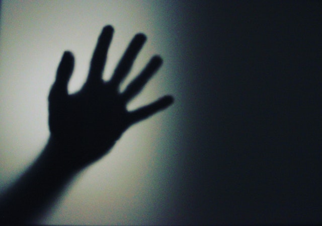 A shadow of a hand reaching