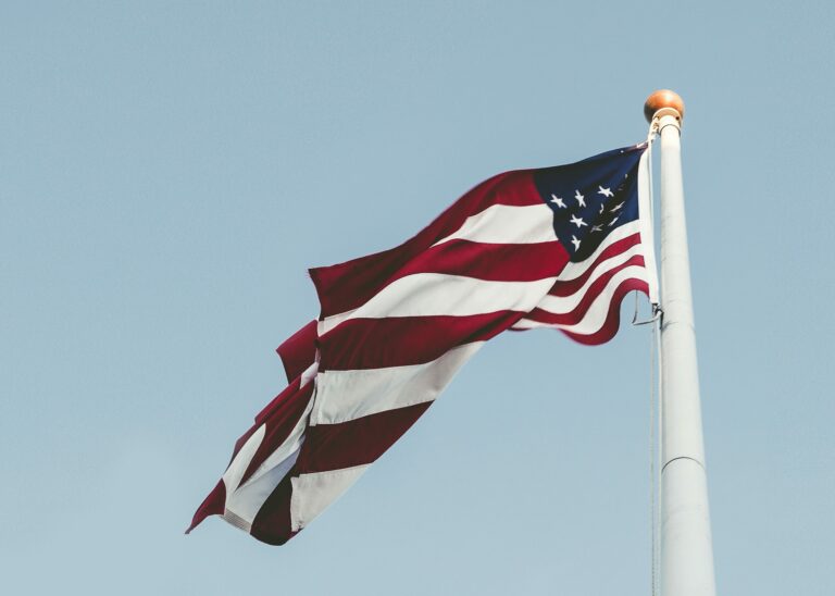 American Flag against a blue gray sky