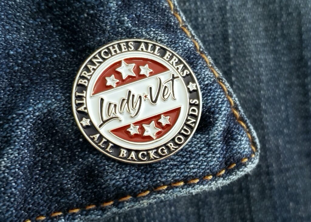 Lady Vet Lapel Pin on a jean jacket
