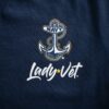 A closeup of Navy Lady Vet logos on a navy blue tee.