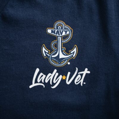 A closeup of Navy Lady Vet logos on a navy blue tee.