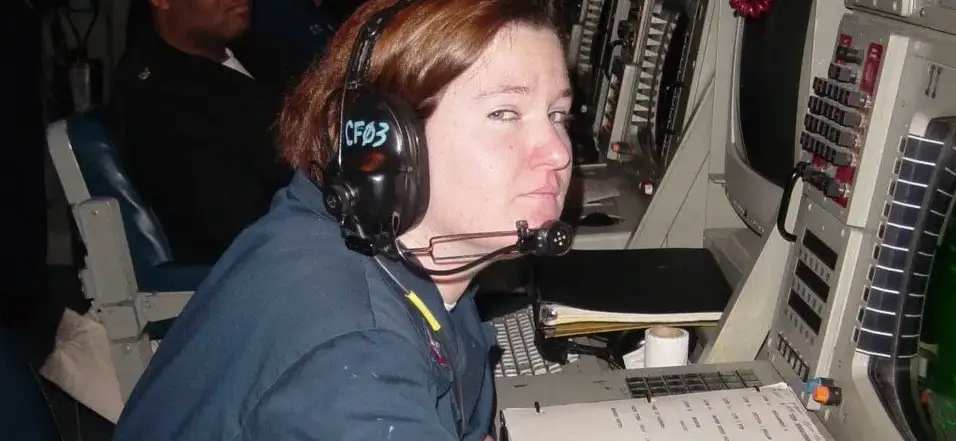 Closeup of Sailor working at a console on a Navy Ship.
