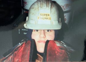 A woman in the Coast Guard wearing a helmet that says Super Chunks